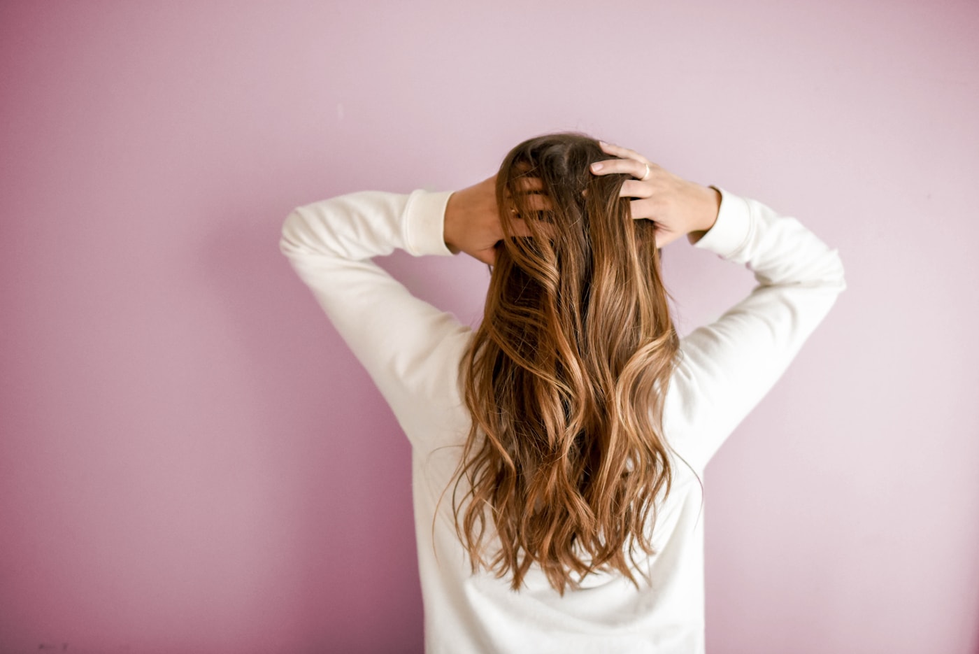 Hair stylist creating a polished long haircut