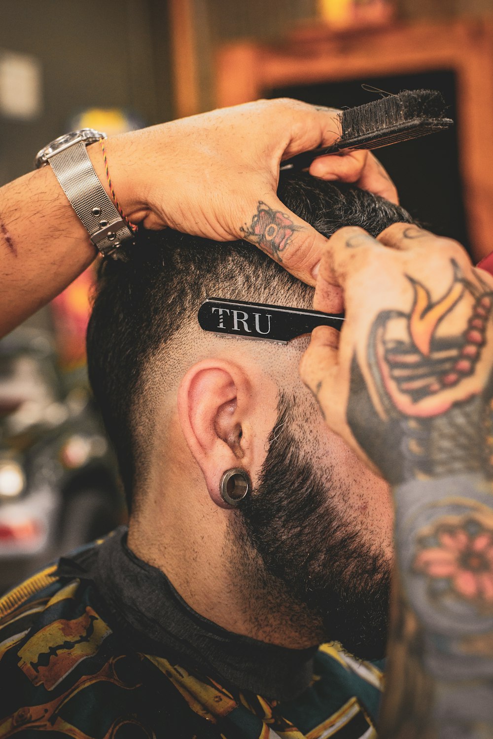 Modern men's haircut in progress